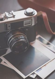 an old camera sitting on top of a table