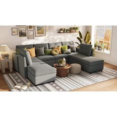 a living room with a sectional couch and ottoman