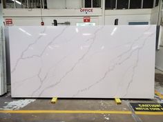 a large white marble slab in a warehouse