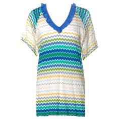 This colorful Missoni signature crochet-knit tunic is designed for a sexy summer day. It the perfect mini piece for sun-soaked days on the beach. Throw it over your bikini for a stylish lunch or team it heels for a cool dinner look. Beautiful colorful shades Ruffle trimmings Classic MISSONI signature zigzag knit So versatile - wear it as mini dress or top Simply slips on Dry Clean only Made in Italy Size 38 New, unworn Please refer to the AD picture for style reference only Spring V-neck Crochet Beach Dress, Summer Crochet Pointelle Knit Dress, Summer Crochet Dress With Pointelle Knit, Summer Crochet Dress In Pointelle Knit, Summer Pointelle Knit Crochet Dress, Green Knit Crochet Beach Top, Blue V-neck Crochet Dress For Vacation, Green Knit Crochet Top For The Beach, Beach Crochet Knit Top In Green