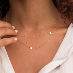 Material: Stainless Steel Plated, Yellow Gold Layering Made Easy! This One-And-Done, Double-Row Necklace Takes The Guesswork Out Of Mixing And Matching Up Necklaces. It Features Two Dainty Italian Chains Connected At The Clasp And Is Punctuated With Two Tiny Star Charms. - Yellow Gold-Plated Stainless Steel - 19/20" Chain Length - 2.41 Grams - Lobster Clasp Closure New On Card. Never Worn. Comes With Dust Bag. From A Smoke Free And Pet Free Home Star Charm Layered Necklace As Gift, Gift Layered Necklace With Star Charm, Star-shaped Layered Necklace Gift, Adjustable Star Charm Necklaces, Adjustable Star Charm Necklace, Star-shaped Clavicle Chain Charm Necklace, Star Clavicle Chain Charm Necklace, Double Necklace, Tiny Star