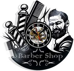 a barber shop wall clock with scissors and combs