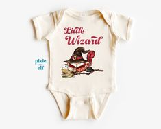 Little Wizard baby one piece, future wizard baby bodysuit, magic and dark academia baby onepiece, new baby announcement, gift for new baby Packaging:  The item will be folded and individually package into resealable clear poly bags. It will then be placed inside a white polymail bag to be shipped to you. Material:  100 % cotton  Regular fit, midweight 180 gsm  preshrunk to minimise shrinkage Washing Instruction: Wash the T Shirt before wearing it. Cold, gentle wash setting with like colours only Flip the shirt inside out before washing Do not tumble dry Do not use harsh detergents or bleach Do not dry clean Warm iron, inside out This shirt is made in Australia. Please check our shop for more T shirts. Please leave us a review to help our shop grow. Harry Potter Pregnancy Announcement, Harry Potter Baby Gift, Harry Potter Onsies Cricut, Harry Potter Toddler Clothes, Harry Potter Babygrow, New Baby Announcement, New Baby Announcements, Poly Bags, Baby One Piece