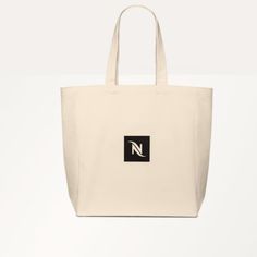 It's A Nespresso Brand New Tote Bag This Tote Bag That Can Also Accommodate Your Personal Belongings. An Essential Item To Use Over And Over Again. This Upcycled Tote Bag Is Made Of 100% Cotton Containing 65% Recycled Material. Size: H 38 Cm, L 46 Cm, W 12 Cm Square Canvas Bag With Dust Bag For Everyday Use, White Eco-friendly Bag For Everyday Use, Large Canvas Bag For Daily Use With Dust Bag, Eco-friendly White Bag For Everyday Use, Everyday Eco-friendly White Bag, Customizable White Tote Bag, Eco-friendly White Tote Bag, Nespresso Citiz White, Eco-friendly Personalized Tote Bag