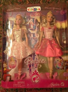 two barbie dolls in pink and gold dresses