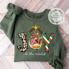 Christian Christmas Sweatshirt, Joy To The World shirt, Jesus Christmas Shirt, Merry Christmas 2024 shirt, Nativity Oh Holy Night Xmas shirt Welcome to TheEcoArtGallery! I'm glad to welcome you! Your presence is well appreciated, and I'm delighted you are here. Please ask for any assistance. I hope to help you and make your visit meaningful. I have many brand shirts you are looking for. Here is the featured.  BELLA CANVAS SHIRT 100% Airlume combed and ringspun cotton (fiber content may vary for different colors) Light fabric (4.2 oz/yd² (142 g/m Retail fit Tear away label Runs true to size GILDAN SHIRT Medium fabric (5.3 oz/yd² (180 g/m Classic fit Runs true to size 100% cotton (fiber content may vary for different colors) Tear-away label RABBIT SKINS SHIRT Light fabric (4.5 oz/yd² (153 g/ Jesus Christmas Shirt, Jesus Christmas, Oh Holy Night, Christmas Jesus, Brand Shirts, Xmas Shirts, Christian Christmas, Holy Night, Joy To The World