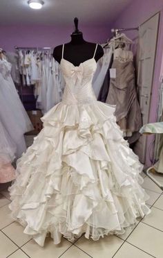 a wedding dress on display in a store