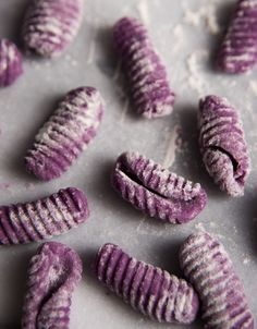 some purple cookies that are on a table