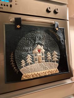 an oven door with a painting on it