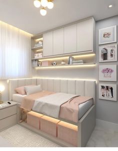 a bedroom with white furniture and lights on the wall above the bed is lit up by recessed lighting