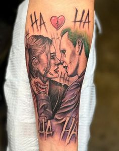 a man with a tattoo on his arm has an image of two people kissing and the words ha ha