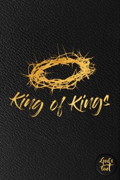 the word king of kings written in gold on black leather