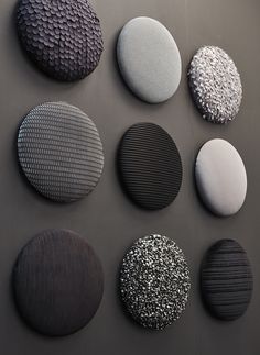 six different types of round objects on a gray surface with black and white circles in the middle