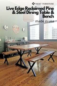 a table and benches in a room with large windows