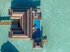 an aerial view of a house on the beach