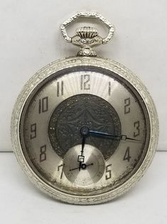 Vintage Swiss Fontain Pocket Watch, Size 36mm, 6 Jewels, Working. Not timed for accuracy. Movement with, Fontain Watch Co., Swiss, Non Magnetic, 6 Six Jewels, 2 Two Adjustments. Inside back of case with, Star Watch Case Co., Scepter, 6742202. Dial with some wear to finish. Crystal with some scratches. Case with wear to finish, some scratches and a small nick on back. We do not test items to see how long or how accurate they run. All items we sell have had a previous owner(s). None, and I'll repeat it, none of our watches online are currently serviced unless they state so in the description. To get a watch overhauled (timing etcetera) it costs 3-400+ not including shipping both ways. If an Item that is listed states, "Running", it simply means that when wound or plugged in that it is runnin Analog Pocket Watch With Round Dial For Formal Occasions, Round Pocket Watch With Subdials For Anniversary, Vintage Silver Watch With Metal Dial, Silver Pocket Watch With Subdials, Antique Silver Watch Accessories For Anniversary, Collectible Silver Pocket Watch With Round Dial, Silver Collectible Pocket Watch With Round Dial, Antique Silver Watch With Round Dial, Antique Silver Watches With Subdials