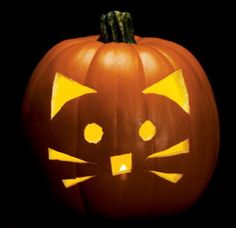 a pumpkin with a cat's face carved into it