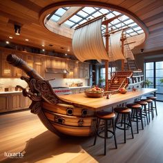 a boat shaped kitchen island in the middle of a room