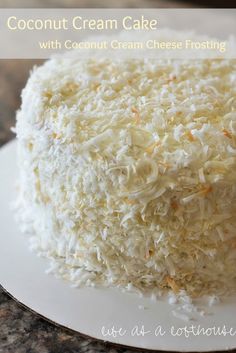 a close up of a cake on a plate with the words coconut crumb cake