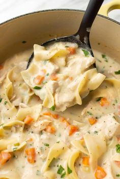 a skillet filled with chicken noodle soup