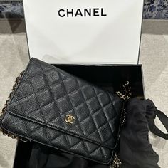 This Is An Authentic Chanel Wallet On Chain (Woc). It Is Crafted From Black Caviar Leather With Gold Hardware. It Has A Leather Chain Threaded Shoulder/Crossbody Strap That Hits Below The Waist. Black Caviar Leather Gold Tone Hardware Interlocking Cc Logo Grosgrain Lining With Card Slots Snap Closure At Front Date: 2013-2014 Made In Italy 7.5"W X 5"H X 1.5"D Shoulder Strap Drop: 18" Condition: Great; Minor Wear On Corner And Trim; Scratches Classic Formal Wallet With Chain Strap, Classic Chain Wallet For Formal Occasions, Classic Chain Wallets For Formal Occasions, Formal Rectangular Wallets With Chain, Formal Rectangular Wallet With Chain, Elegant Leather Wallet With Chain Detail, Elegant Leather Wallet With Chain, Elegant Wallets With Chain For Daily Use, Elegant Leather Wallets With Chain