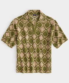 a green and white shirt with an intricate pattern