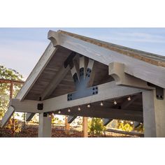 the underside of a building with lights hanging from it's roof and on top