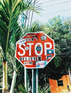 a stop sign with stickers all over it