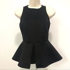 Never Worn As It’s A Bit Too Snug. Excellent Condition, No Flaws Zips In Back Please See Pictures Unique Piece This Is Such A Cool Top! The Material Has A Scuba Material Feel To It. Really Well Constructed. Rich Black In Color Size Xs 94% Polyester, 6% Spandex 12.5” Waist, 14” Arm To Arm, 22” In Length From Top Of Back To Bottom Hem Measurements Are Approximate And Taken While Lying Flat Chic Black Racerback Tank Top, Chic Black Racerback Top, Chic Racerback Party Tops, Casual Stretch Tank Top For Evening, Black Casual Evening Tank Top, Top Sleeveless, Unique Pieces, Womens Tops, Spandex