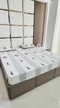 the bed is made up and ready for someone to use it in their home or office