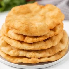 a stack of cookies sitting on top of a white plate