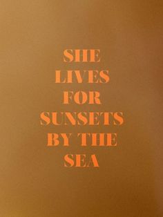 the words she lives for sunsets by the sea are written in orange on an orange background