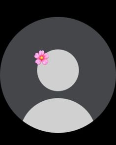 a pink flower sitting in the middle of a black circle