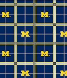 a blue and yellow plaid pattern with the letter m on it