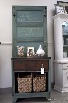 an old dresser with baskets on it and a chalkboard above the top that says i love you