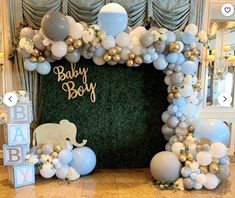 a baby boy party with balloons and decorations