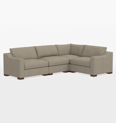 a large sectional couch sitting on top of a white floor