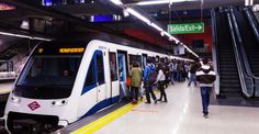 people are waiting for the subway to arrive