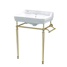 a white sink sitting on top of a metal stand with two faucets underneath it