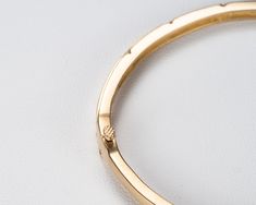 Our beautiful solid gold bezel-set diamond bangle bracelet is a timeless classic that's perfect for your wedding or anniversary, or to add as a family heirloom to your jewelry collection. It features a figure 8 locking hinge for extra security. Made with VS1 diamonds and available in 14k, 18k yellow, rose, white gold and platinum. This bracelet is fully customizable. If you prefer different size dimensions, or moissanites or colored gemstones, please contact us today to get started on a custom o Oval Gold Bracelet With Bezel Setting, Gold Oval Bracelet With Bezel Setting, Elegant Oval Bracelets With Bezel Setting, Timeless Diamond Cut Bangle For Formal Occasions, Fine Jewelry Bezel Setting Bracelets For Anniversary, Diamond Bangle In Polished Yellow Gold, Fine Jewelry Yellow Gold Bangle With Brilliant Cut, Fine Jewelry Bracelets With Bezel Setting For Anniversary, Oval Yellow Gold Bracelet With Single Cut Diamonds