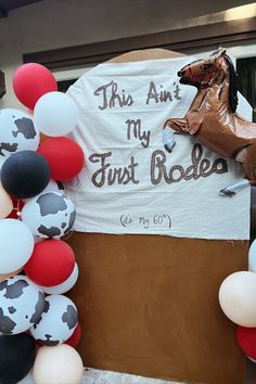 this is an image of a horse and balloon arch for a rodeo themed birthday party