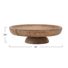 a wooden bowl with measurements for the base