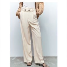 Brand New. High Waisted Pant. Front Hook And Zip Closure. Side Pockets. Ecru Color Chic Beige Wide Leg Pants For Day Out, Trendy Beige Wide Leg Pants, Elegant Beige Wide Leg Pants For Spring, Trendy Beige Wide Leg Pants For Spring, Beige Wide Leg Pants For Spring Day Out, High Waist Cream Bottoms For Office, Cream Summer Office Bottoms, Summer Cream Bottoms For Office, Chic Beige Wide Leg Pants With Belt Loops