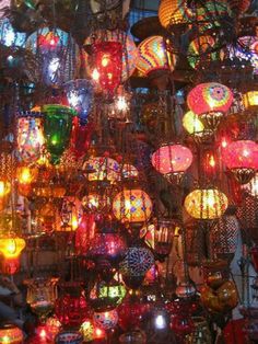 many colorful lights are hanging from the ceiling