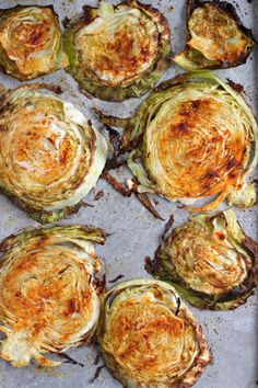 cooked artichokes on a baking sheet ready to be eaten