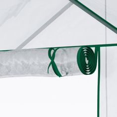 the inside of a green and white tent with straps hanging from it's sides