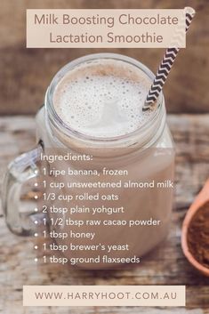 a glass jar filled with chocolate latte on top of a wooden table next to a spoon