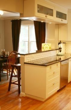 the kitchen is clean and ready to be used for cooking or dining room furniture, as well as other appliances