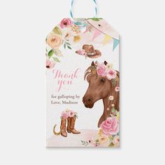 a gift tag with a horse and flowers on it