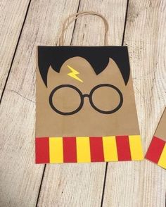 a paper bag with a harry potter face on it and a pair of glasses in the front